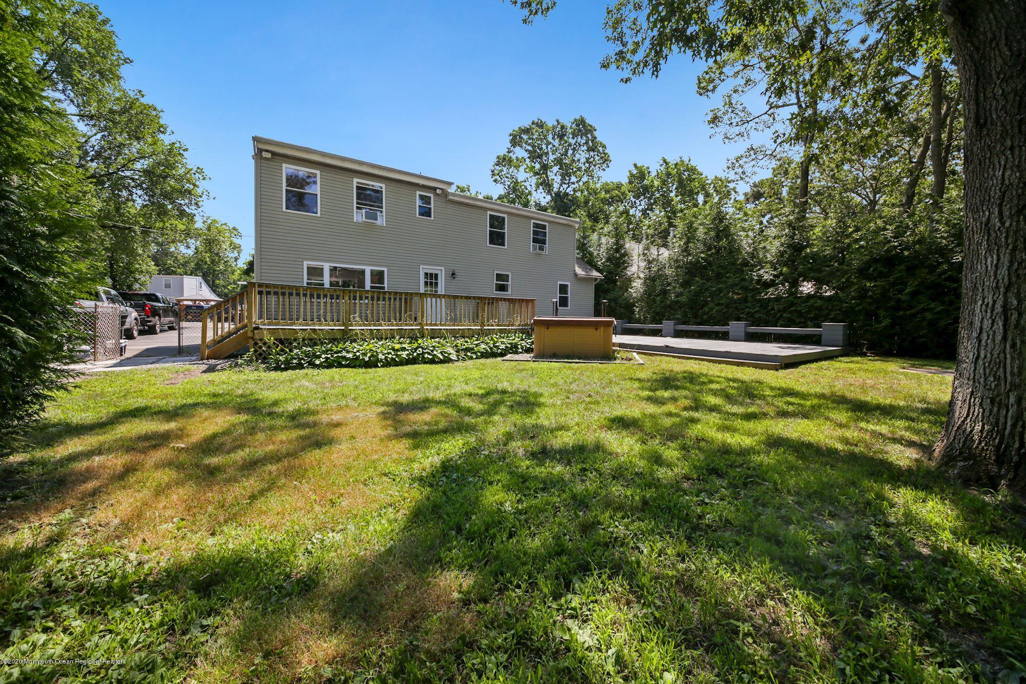 8 Unity Drive Brick, NJ 08723 - Photo 19 of 22 a view of pool with a yard