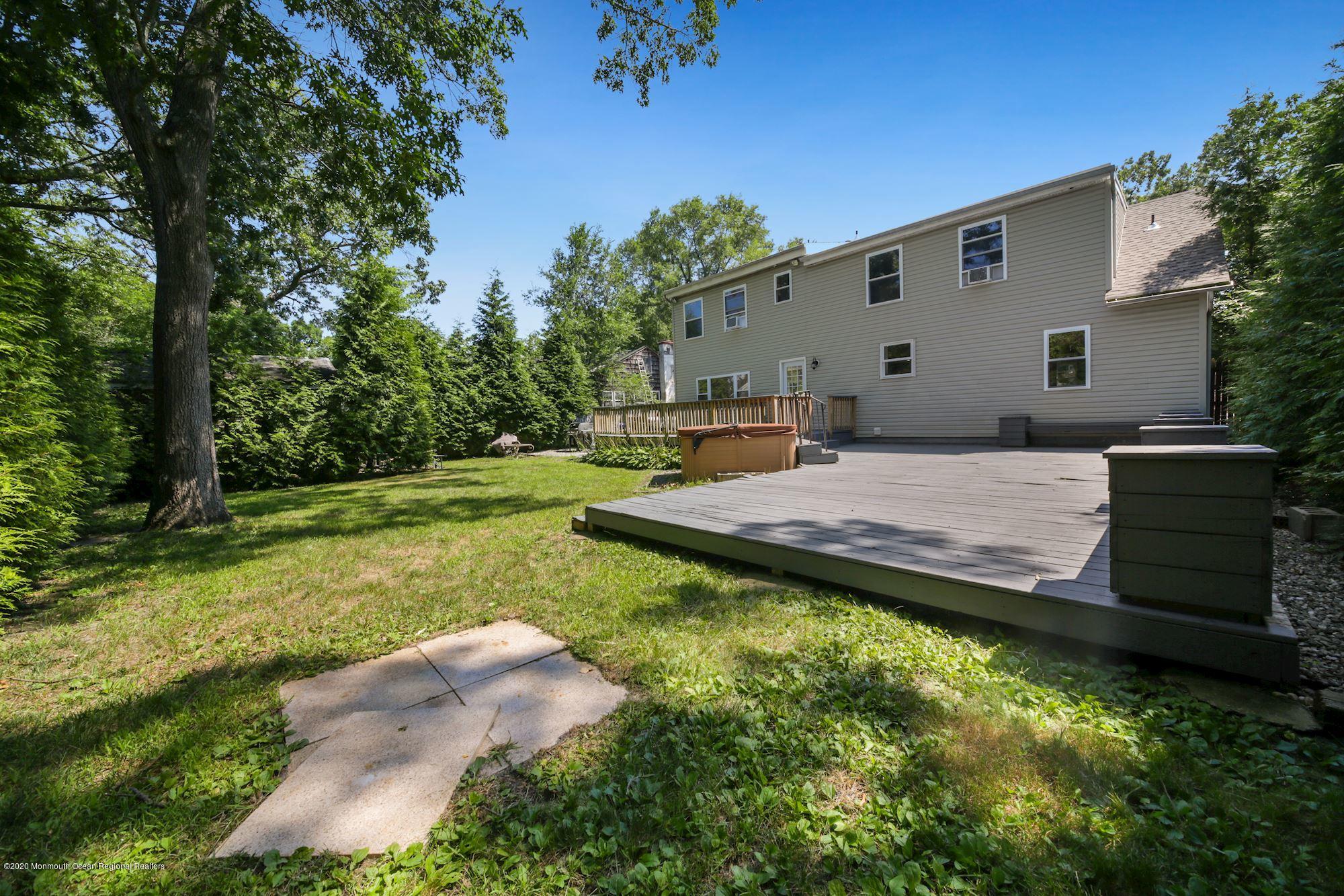 8 Unity Drive Brick, NJ 08723 - Photo 20 of 22 a view of a back yard of the house
