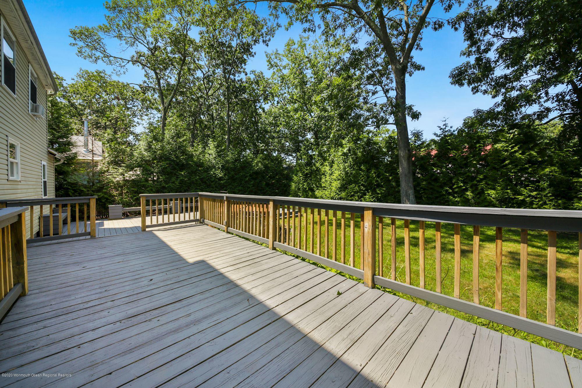 8 Unity Drive Brick, NJ 08723 - Photo 22 of 22 a view of balcony with wooden floor and fence