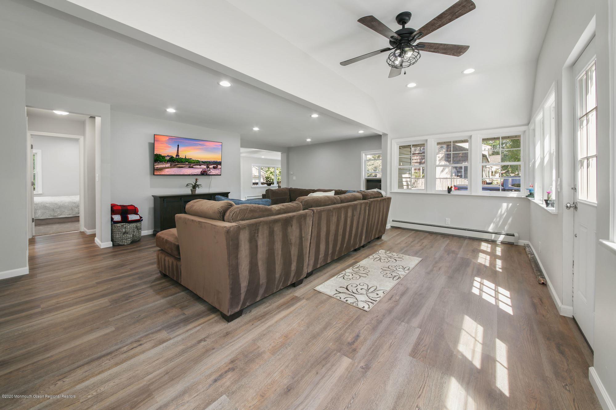 8 Unity Drive Brick, NJ 08723 - Photo 4 of 22 a living room with furniture and a flat screen tv