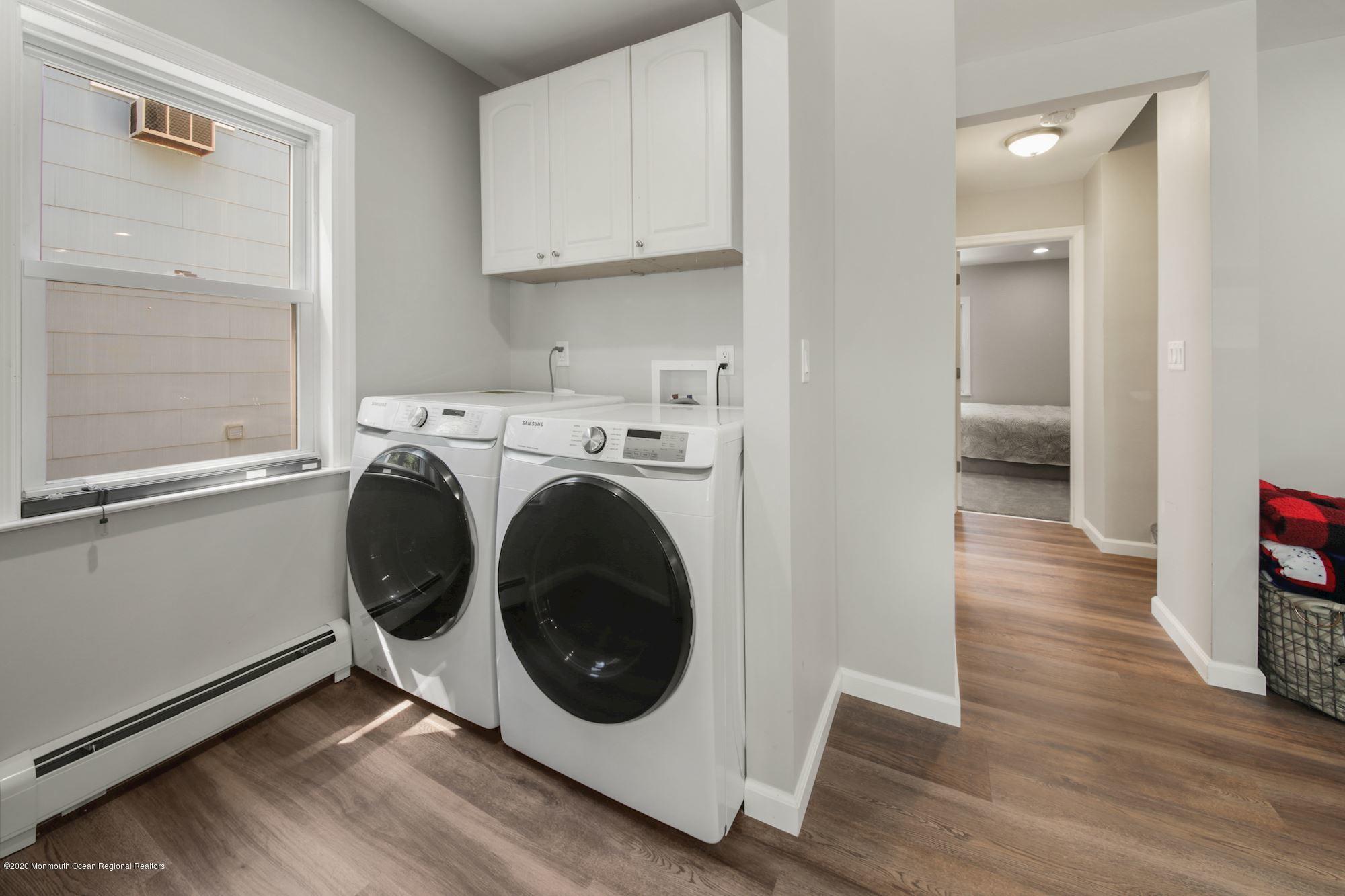 8 Unity Drive Brick, NJ 08723 - Photo 6 of 22 a view of a kitchen with washer and dryer