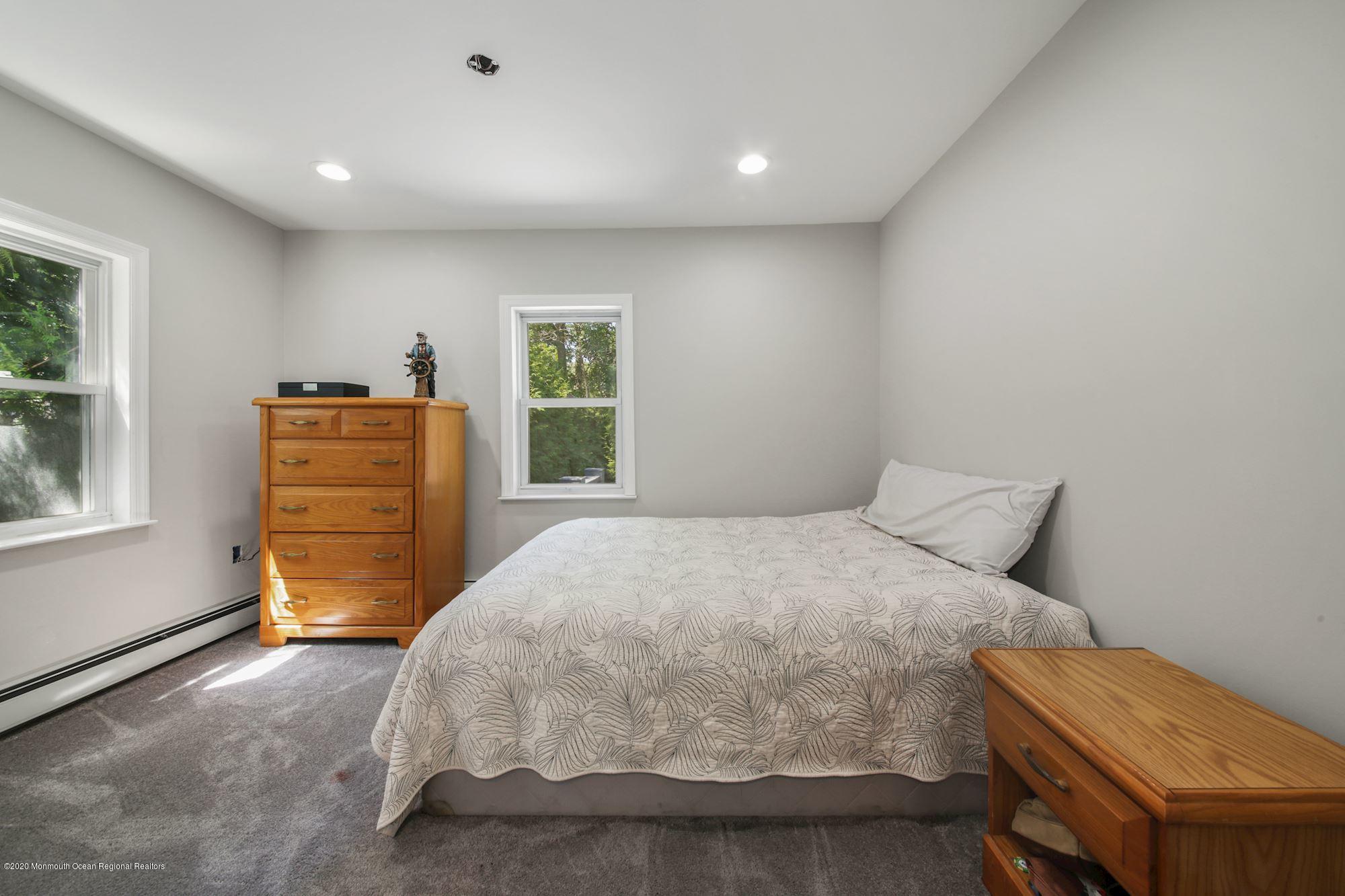 8 Unity Drive Brick, NJ 08723 - Photo 7 of 22 a bedroom with a bed and a dresser