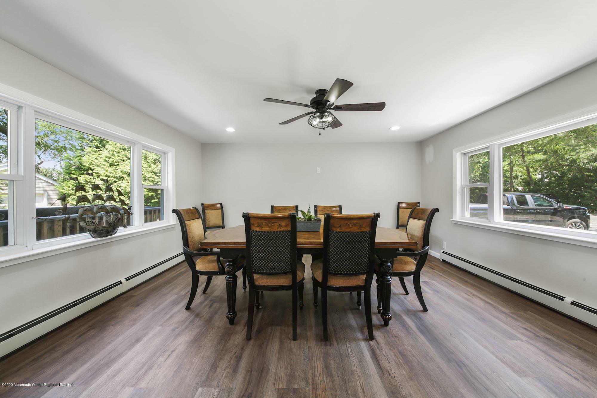 8 Unity Drive Brick, NJ 08723 - Photo 8 of 22 a view of a dining room with furniture window and wooden floor