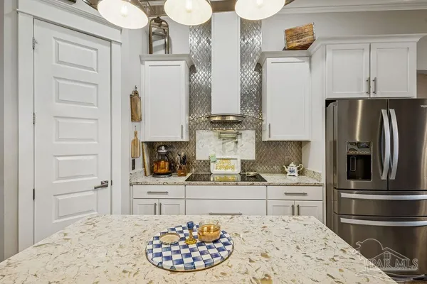 a bedroom with a bed and ceiling fan