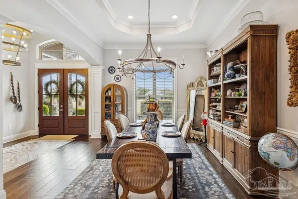 a spacious bathroom with a double vanity sink a mirror and a shower