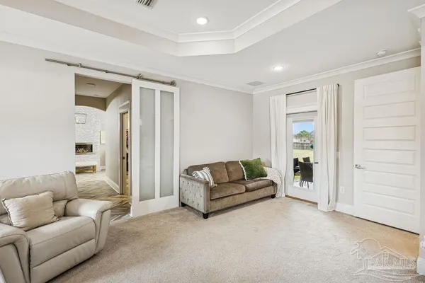 a view of living room filled with furniture and wooden floor