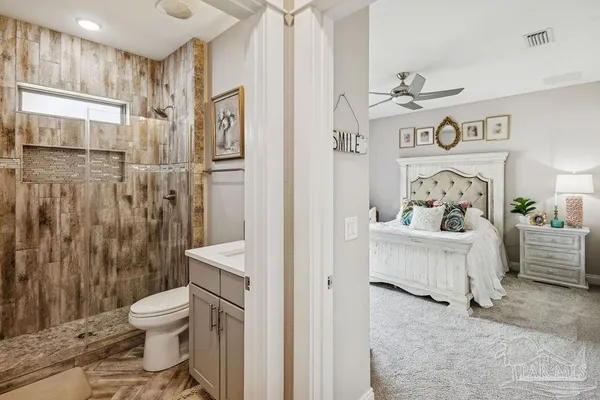 a bathroom with a sink toilet and shower