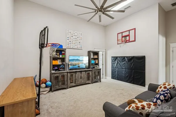 a view of a patio with table and chairs and potted plants