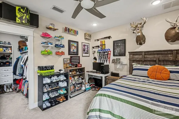 an aerial view of a house with a yard basket ball court and outdoor seating