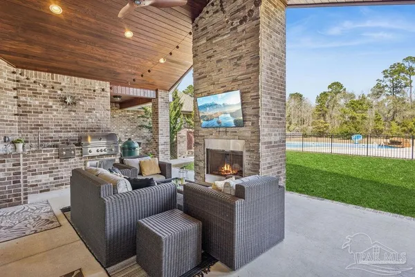 a view of green field with house in the background