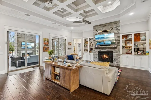 a living room with lots of furniture and a rug