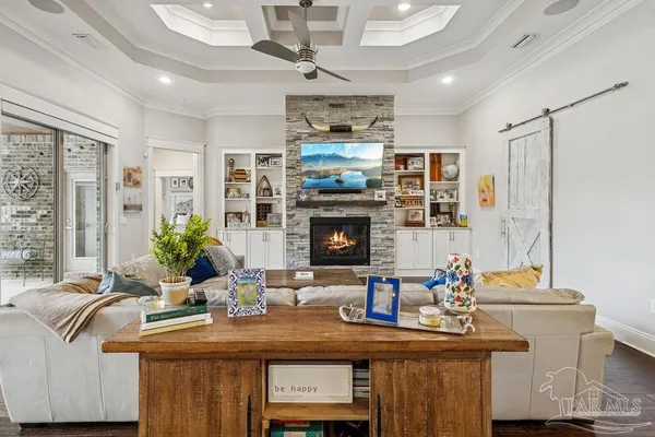 a dining room with furniture and wooden floor