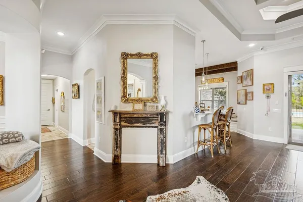 a kitchen with stainless steel appliances granite countertop a sink a stove top oven a counter space and cabinets