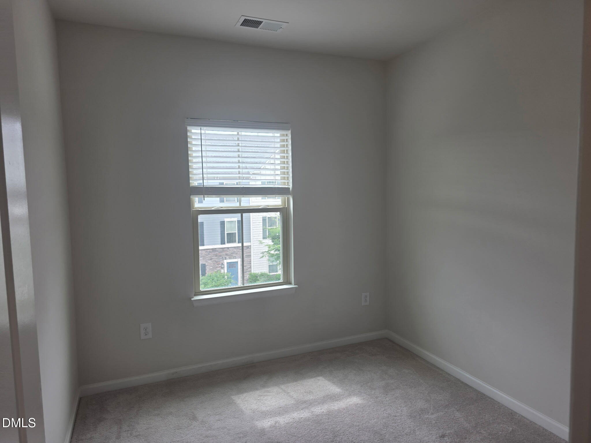 214 Timber Forest Lane Cary, NC 27519 - Photo 11 of 20 an empty room with a window