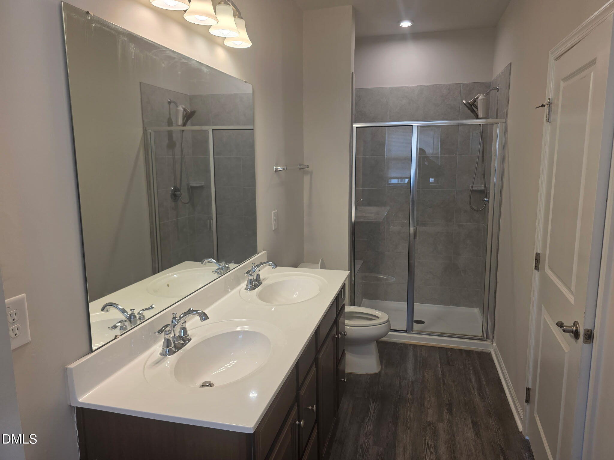 214 Timber Forest Lane Cary, NC 27519 - Photo 16 of 20 a bathroom with a sink a toilet and shower