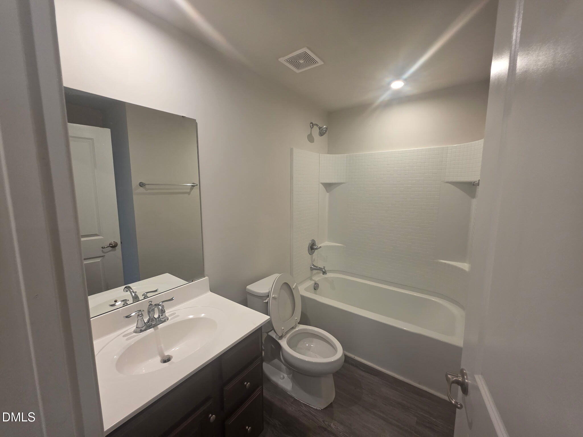 214 Timber Forest Lane Cary, NC 27519 - Photo 4 of 20 a bathroom with a sink toilet and shower