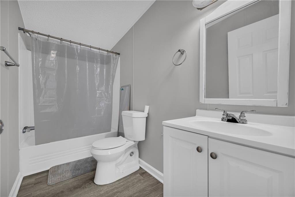 85 Winding Vine Lane Nicholson, GA 30565 - Photo 18 of 40 a bathroom with a sink toilet and shower