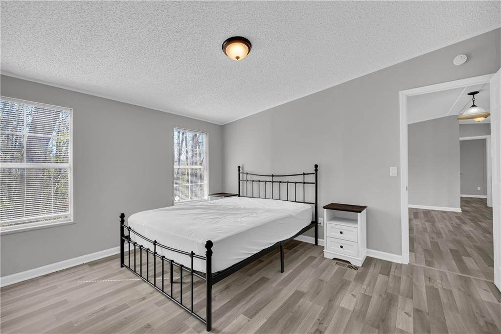 85 Winding Vine Lane Nicholson, GA 30565 - Photo 20 of 40 a bedroom with a bed and window