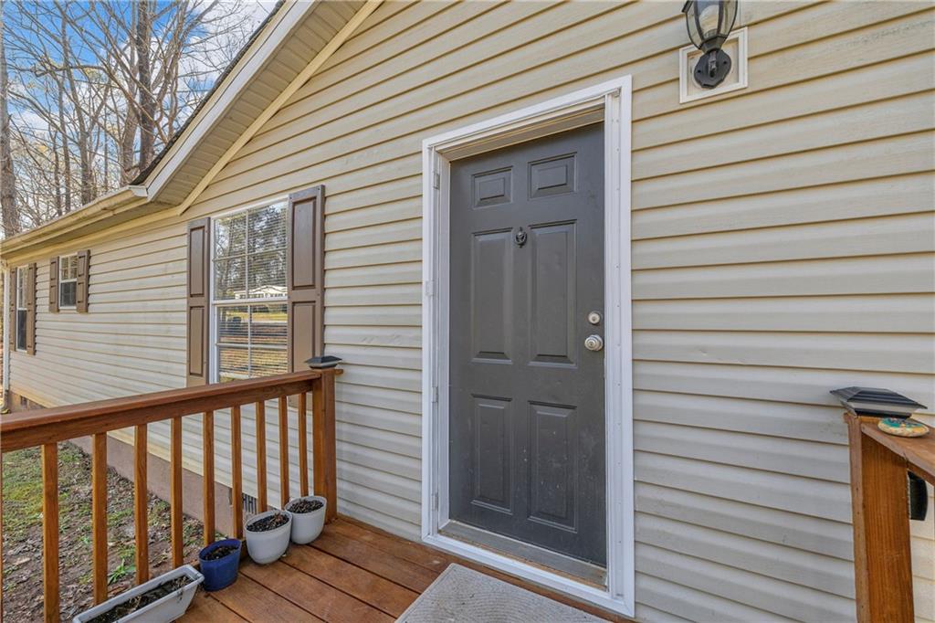 85 Winding Vine Lane Nicholson, GA 30565 - Photo 29 of 40 a view of a porch with wooden floor
