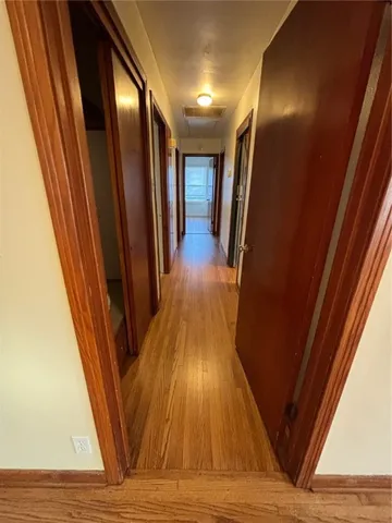 a view of gallery with wooden floor