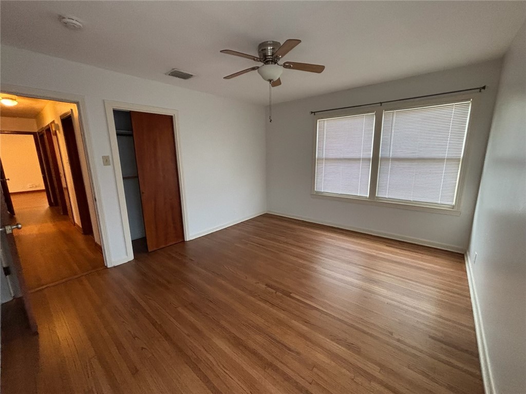 1010 Peerman Place Corpus Christi, TX 78411 - Photo 8 of 8 wooden floor in an empty room with a window