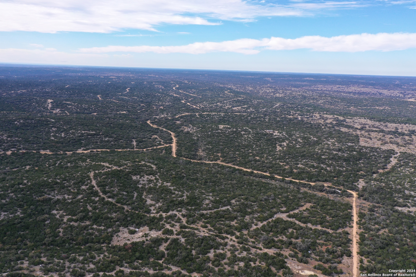 1048 Sd 46067 Del Rio, TX 78840 - Photo 23 of 23 an aerial view of house with yard and mountain view in back