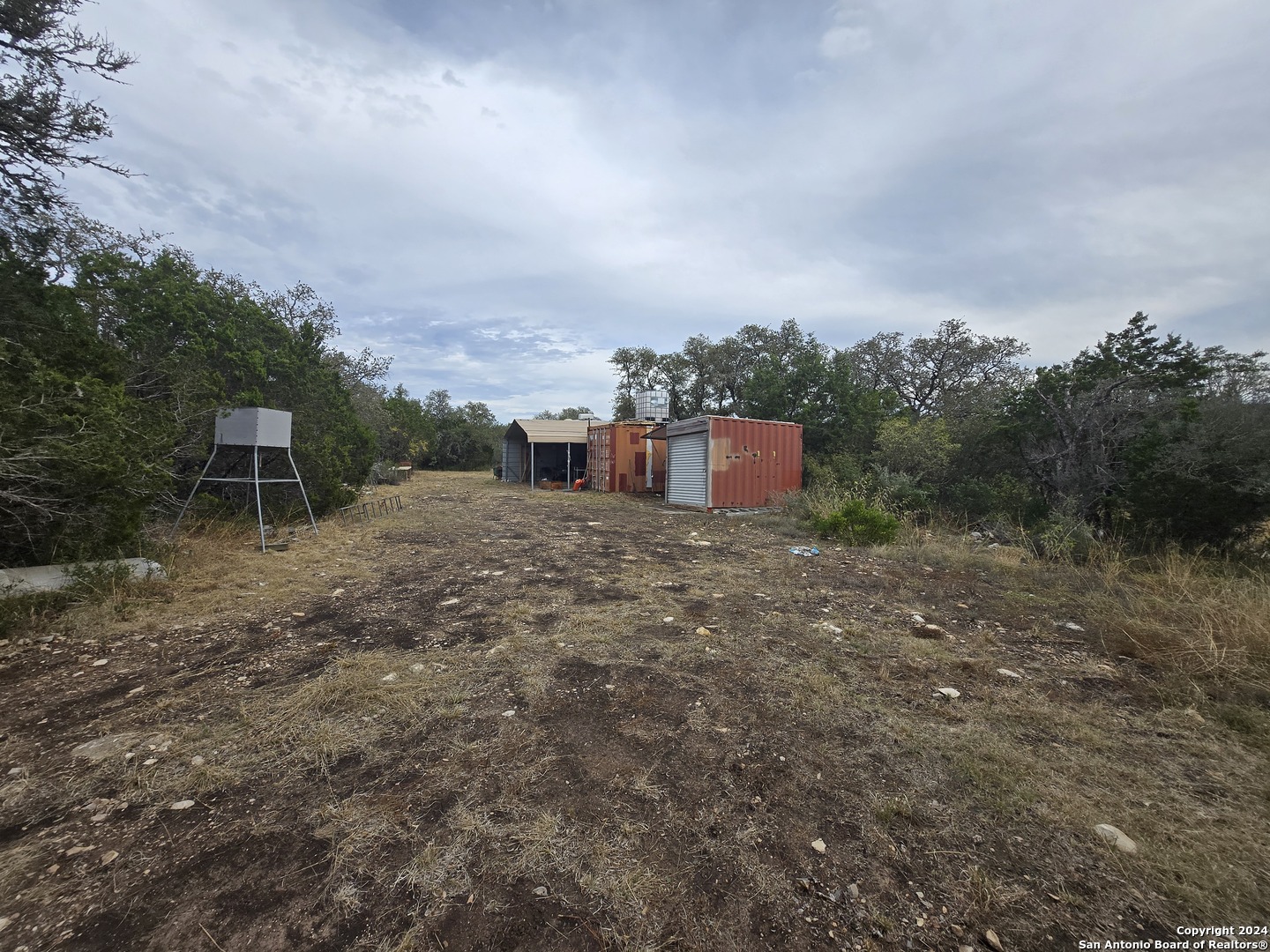 1048 Sd 46067 Del Rio, TX 78840 - Photo 6 of 23 a view of a dry yard with wooden fence
