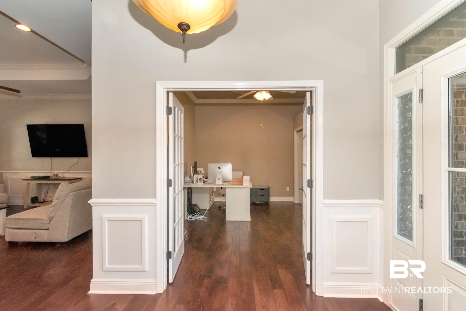 27890 Rileywood Drive Daphne, AL 36526 - Photo 4 of 49 Hallway featuring ornamental molding, dark wood-style flooring, and wainscoting
