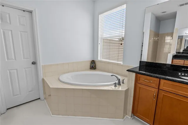 a white bath tub sitting in a bathroom