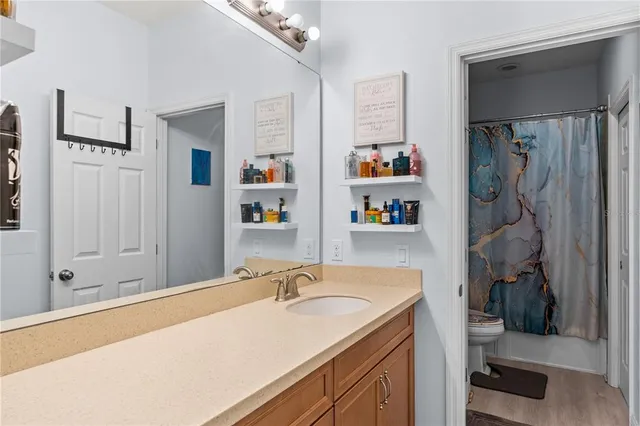 a bathroom with a sink double vanity and a shower