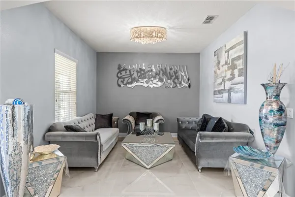 a living room with furniture and a window