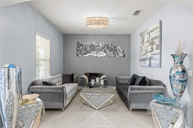 a living room with furniture and a window