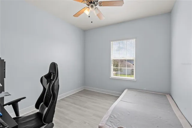a view of a room with gym equipment and a window