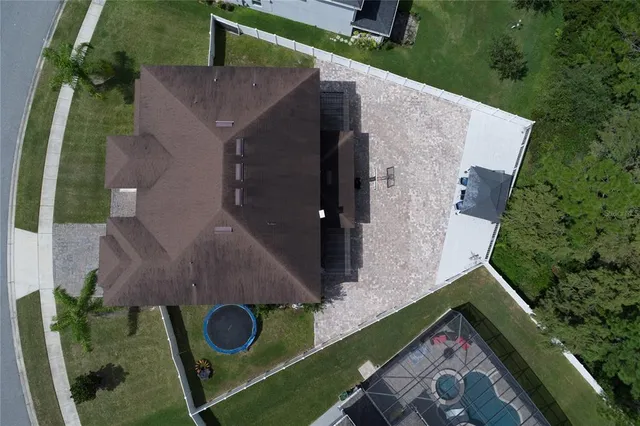 an aerial view of house with yard