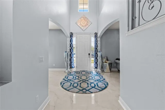 a view of a hallway with paintings on the wall