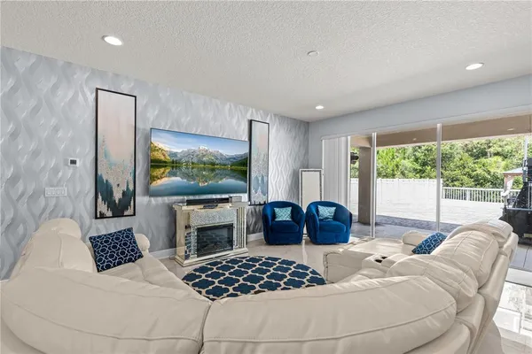 a bedroom with furniture and a large window