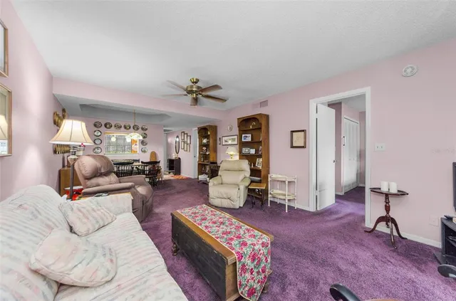 a living room with furniture chandelier and a chandelier