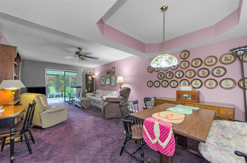 2119 Elm Street, Unit 103 Dunedin, FL 34698 - Photo 15 of 69 a living room with patio furniture and a window