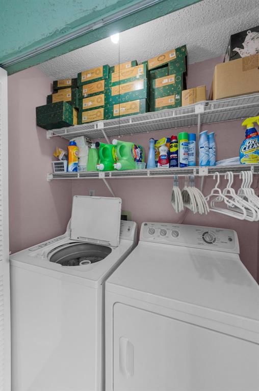 2119 Elm Street, Unit 103 Dunedin, FL 34698 - Photo 32 of 69 a utility room with dryer and washer