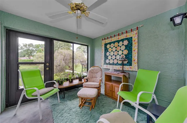 a view of a room with furniture and wooden floor