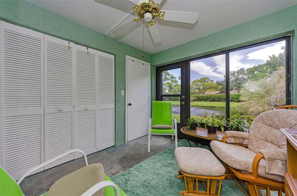 2119 Elm Street, Unit 103 Dunedin, FL 34698 - Photo 34 of 69 a living room with furniture and a large window