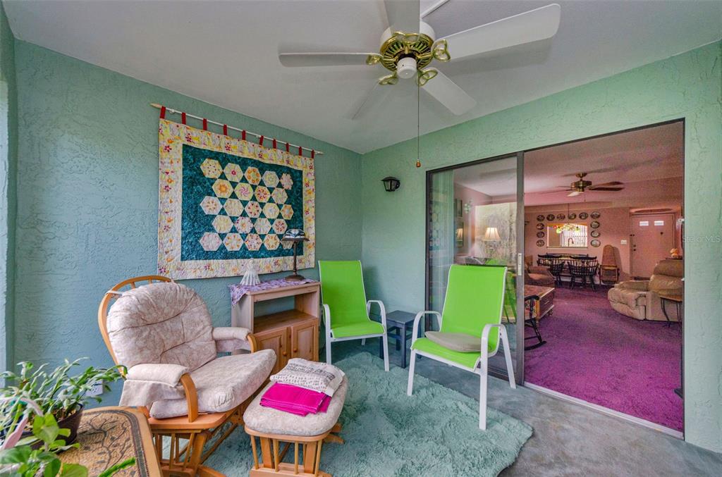 2119 Elm Street, Unit 103 Dunedin, FL 34698 - Photo 35 of 69 a living room with furniture a dining table and a fireplace