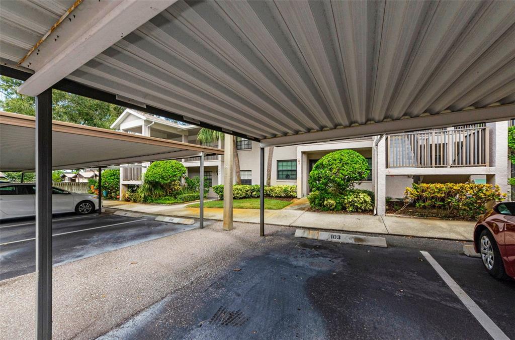2119 Elm Street, Unit 103 Dunedin, FL 34698 - Photo 5 of 69 a view of a house with porch and garden