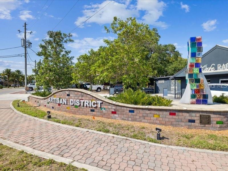 2119 Elm Street, Unit 103 Dunedin, FL 34698 - Photo 60 of 69 a view of outdoor space with signage and flags