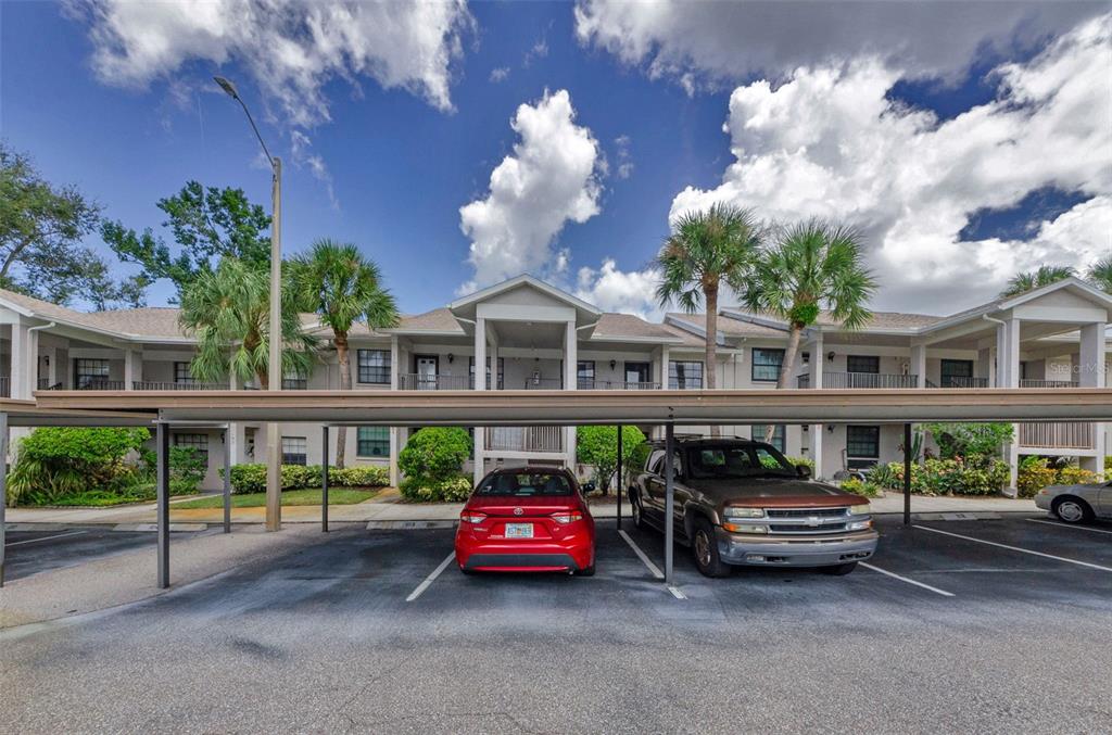 2119 Elm Street, Unit 103 Dunedin, FL 34698 - Photo 6 of 69 a car parked in front of a building