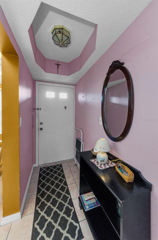 2119 Elm Street, Unit 103 Dunedin, FL 34698 - Photo 10 of 69 a bathroom with a sink a toilet and a mirror