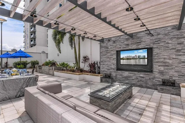 a backyard of a house with lots of green space and glass windows