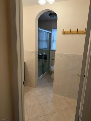 a view of a kitchen from the hallway