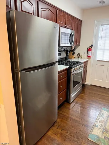 a white refrigerator freezer sitting inside of a kitchen