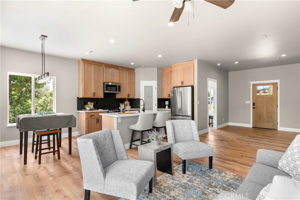 5334 Filbert Street Paradise, CA 95969 - Photo 15 of 30 a living room with furniture a dining table and kitchen view